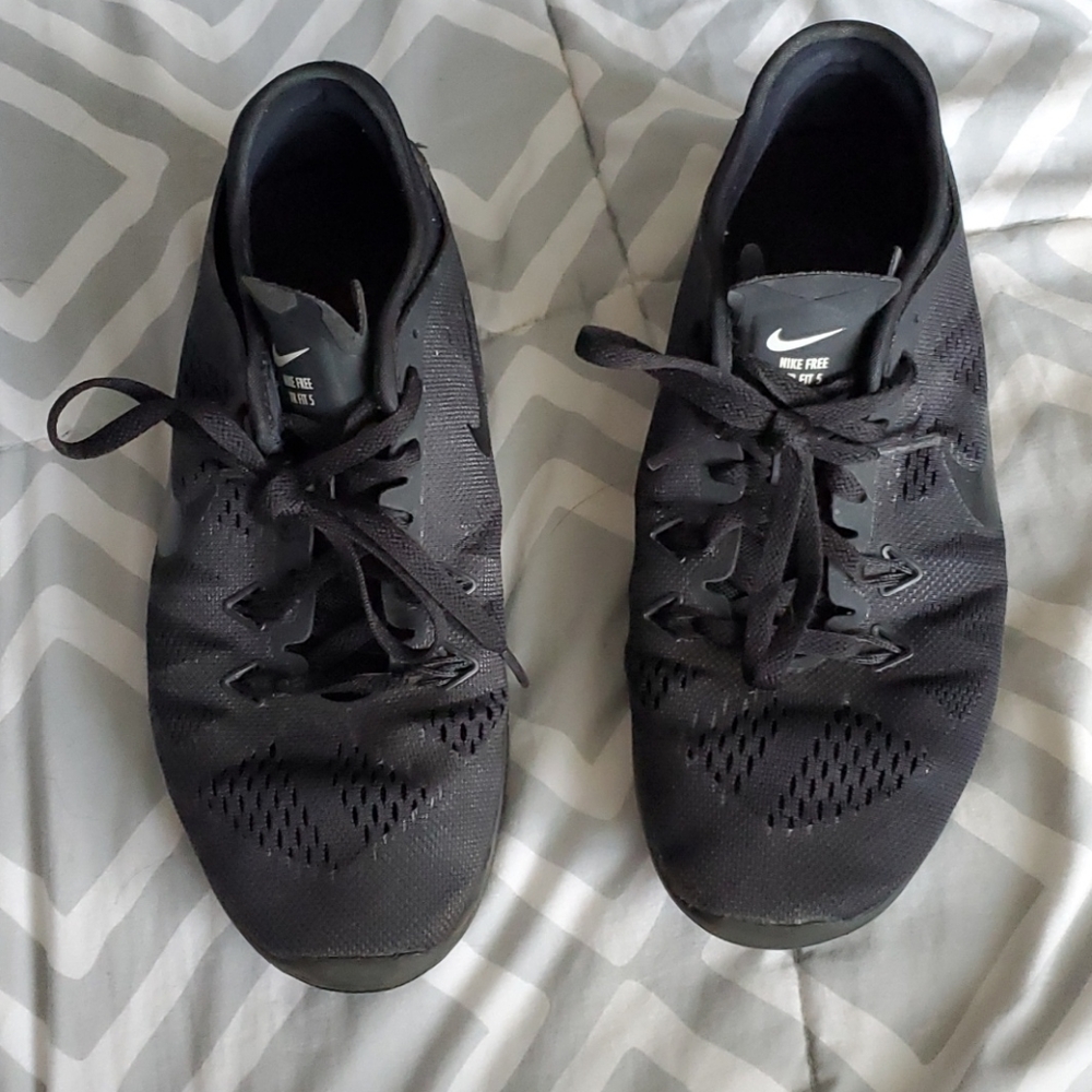 All black Nike running shoes